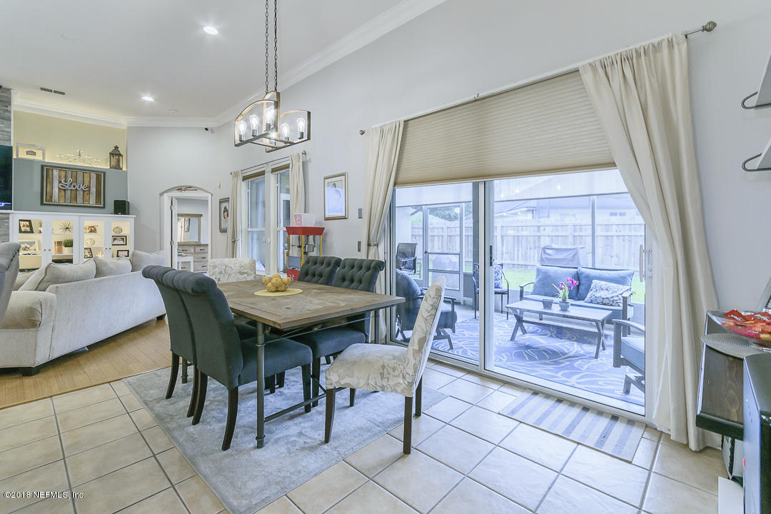 12171 Captiva Bluff Road Jacksonville, FL 32226 - Photo 14 of 36 a view of a dining room with furniture window and outside view