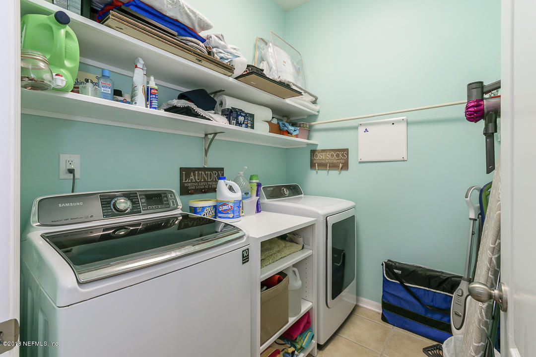 12171 Captiva Bluff Road Jacksonville, FL 32226 - Photo 25 of 36 a utility room with dryer and washer