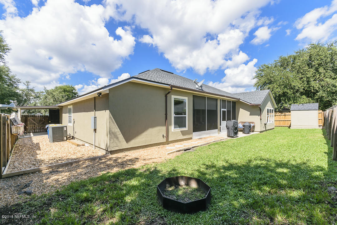 12171 Captiva Bluff Road Jacksonville, FL 32226 - Photo 30 of 36 a view of a house with backyard