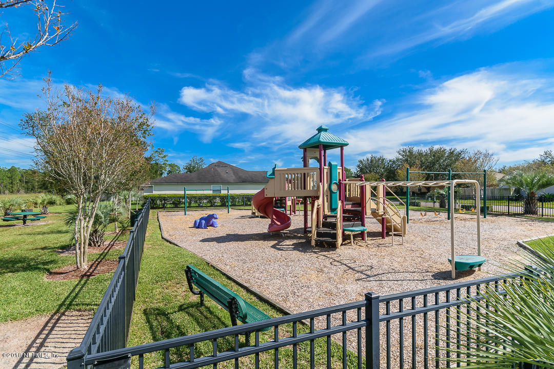 12171 Captiva Bluff Road Jacksonville, FL 32226 - Photo 31 of 36 a view of a park with swings and slides