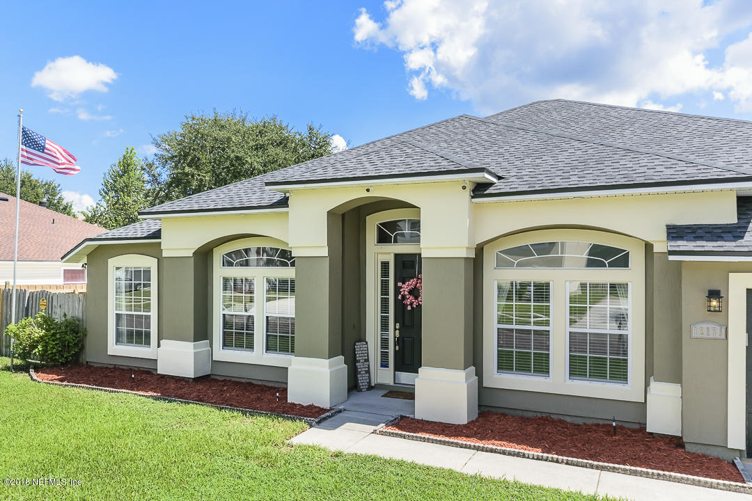 12171 Captiva Bluff Road Jacksonville, FL 32226 - Photo 4 of 36 a front view of a house with a yard
