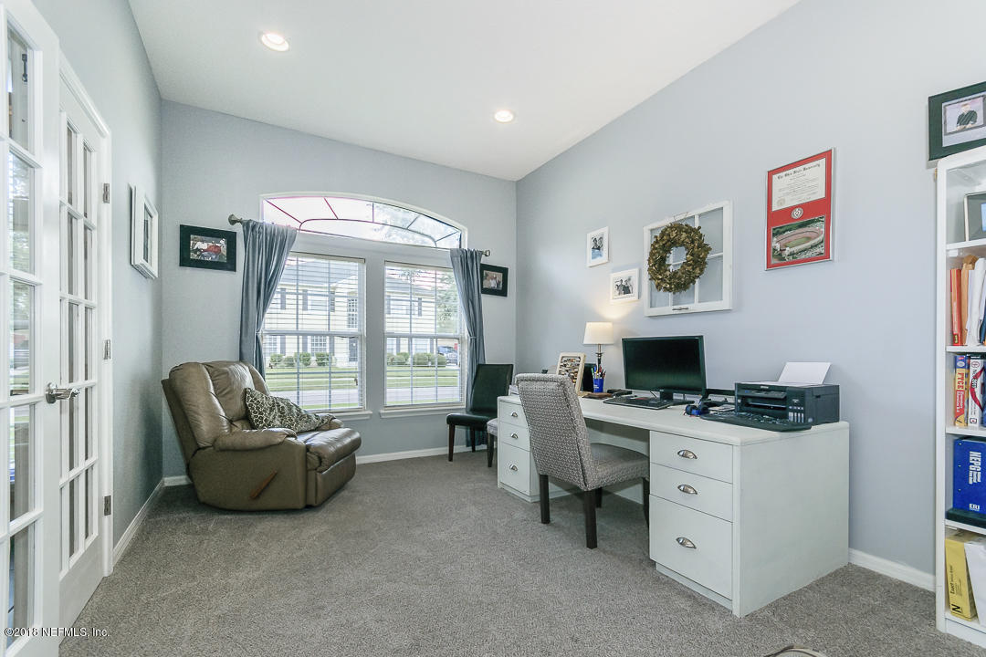 12171 Captiva Bluff Road Jacksonville, FL 32226 - Photo 6 of 36 a livingroom with workspace and a window