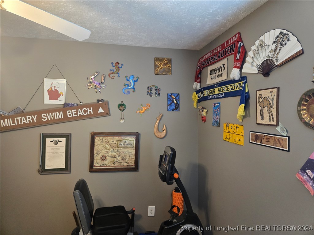 6723 Camden Road Fayetteville, NC 28306 - Photo 14 of 18 a view of a workspace with furniture and toys