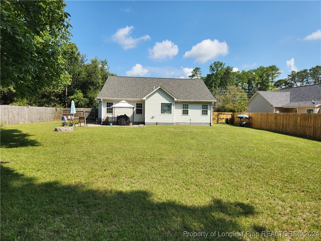 6723 Camden Road Fayetteville, NC 28306 - Photo 17 of 18 a view of a house with a big yard