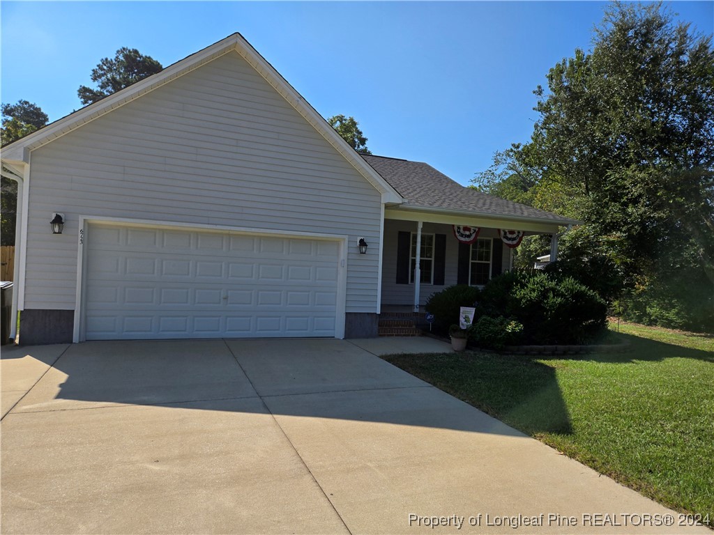 6723 Camden Road Fayetteville, NC 28306 - Photo 3 of 18 a front view of house with yard and green space