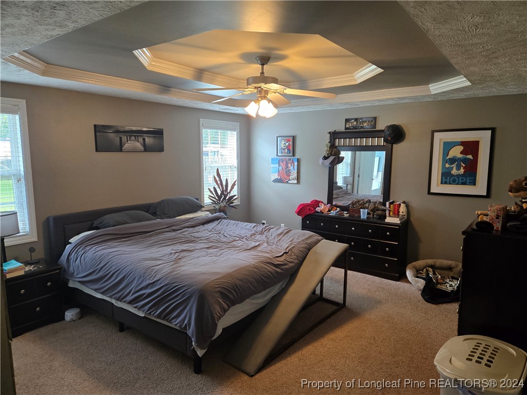 6723 Camden Road Fayetteville, NC 28306 - Photo 7 of 18 a bedroom with a bed gym equipment and a window