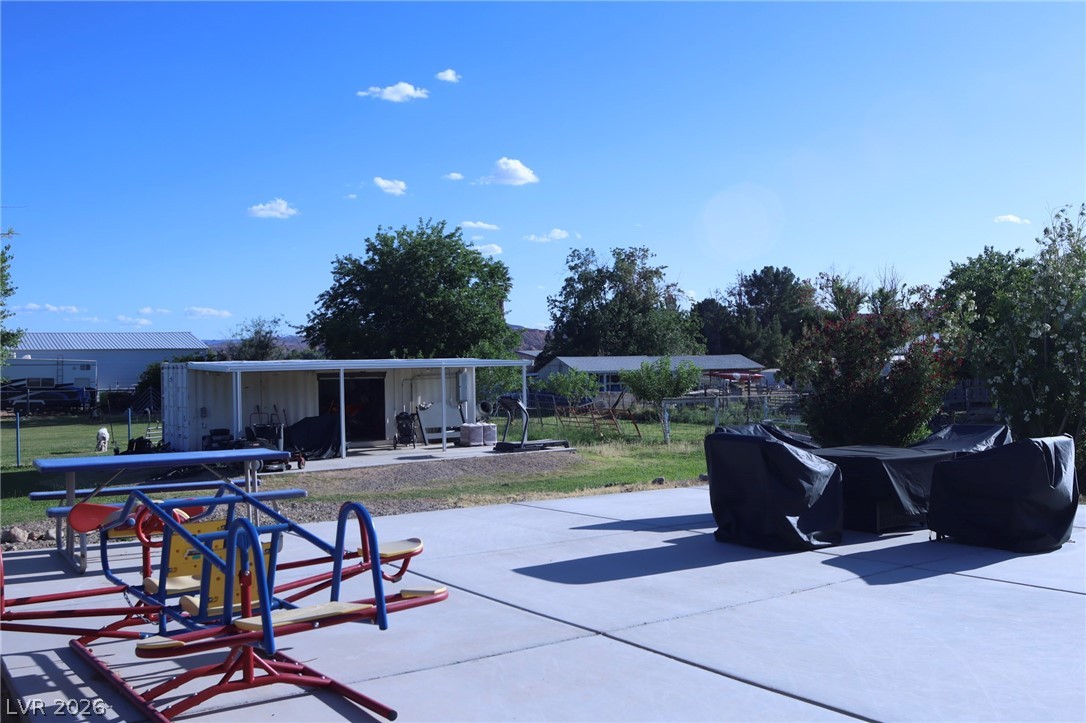 2775 Taylor Street Logandale, NV 89021 - Photo 30 of 41 This spacious yard features concrete paving, a shed, and ample space for various outdoor activities.
