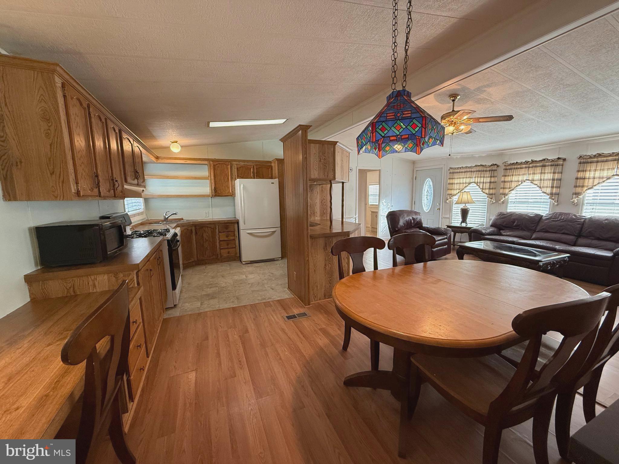 386 Indian Way Buena, NJ 08310 - Photo 4 of 53 a very nice looking dining room with kitchen island a table and chairs