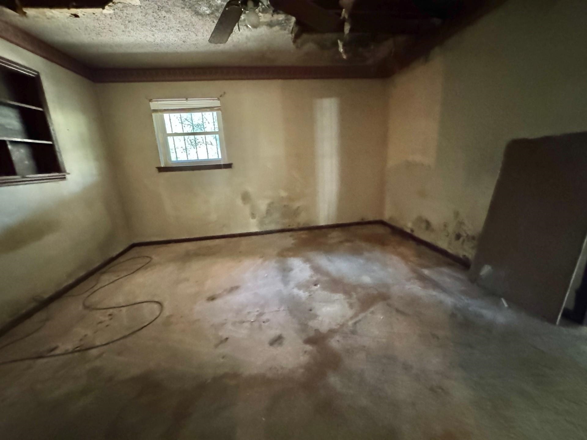 3085 Hoskins Road Memphis, TN 38111 - Photo 9 of 14 Empty room featuring concrete floors, a textured ceiling, and a ceiling fan