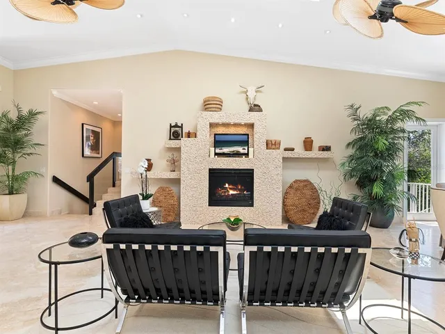 a bath tub sitting next to a white sink and vanity