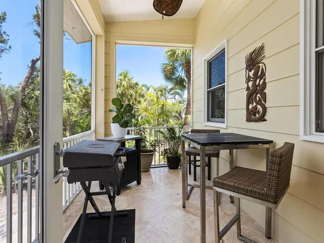 a table and chairs in front of door