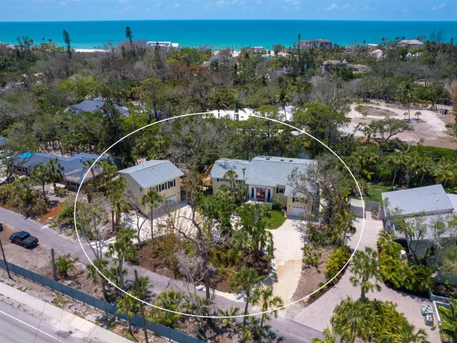 a living room with furniture windows and wooden floor