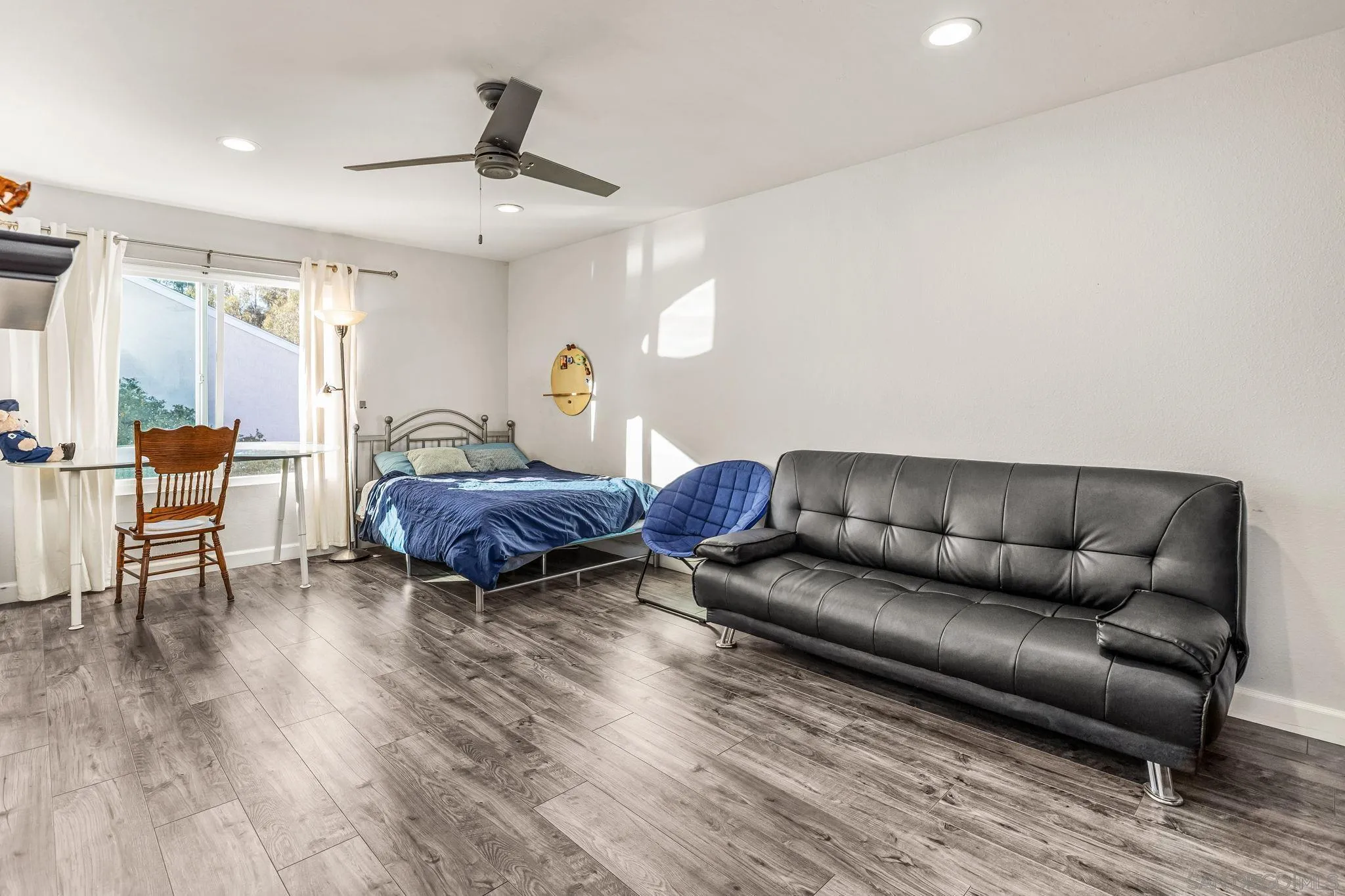 10831 Ironwood Road Scripps Ranch, CA 92131 - Photo 20 of 25 a living room with furniture and a wooden floor
