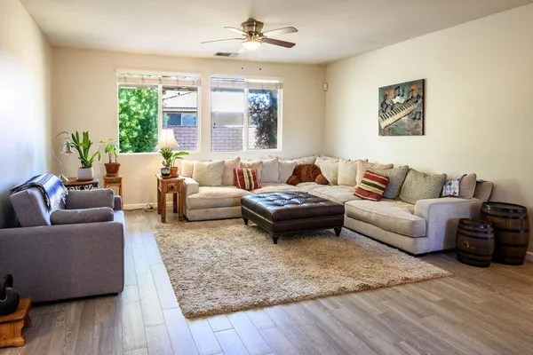 a view of a livingroom with furniture and wooden floor