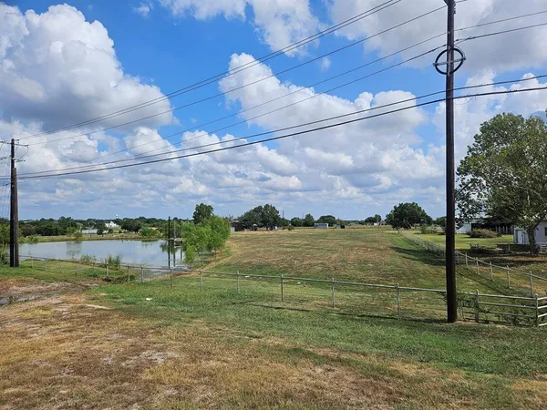 a view of a lake in front of a building