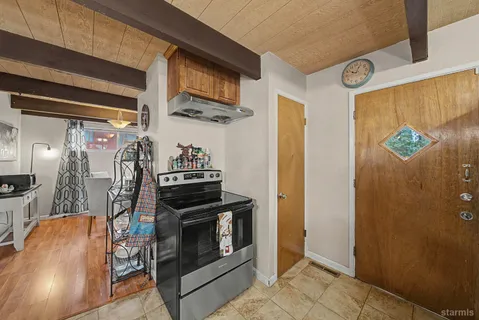 a kitchen with stainless steel appliances granite countertop a refrigerator and a stove
