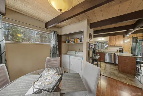 a kitchen with a sink and wooden cabinets