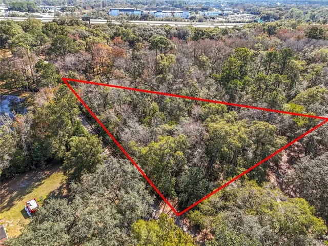 a view of yard with swimming pool