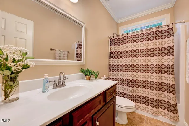 an empty room with closet and a chandelier fan