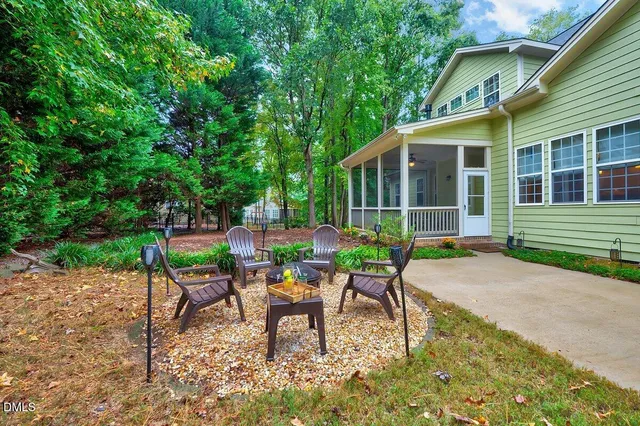 a view of a livingroom with furniture and a large window