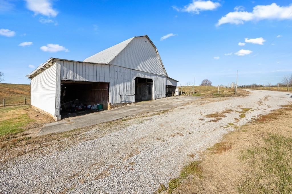 899 Messenger Road Sparta, TN 38583 - Photo 29 of 68 a view of a house with a yard