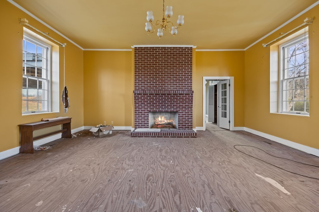 899 Messenger Road Sparta, TN 38583 - Photo 45 of 68 a view of an empty room with a fireplace and a window