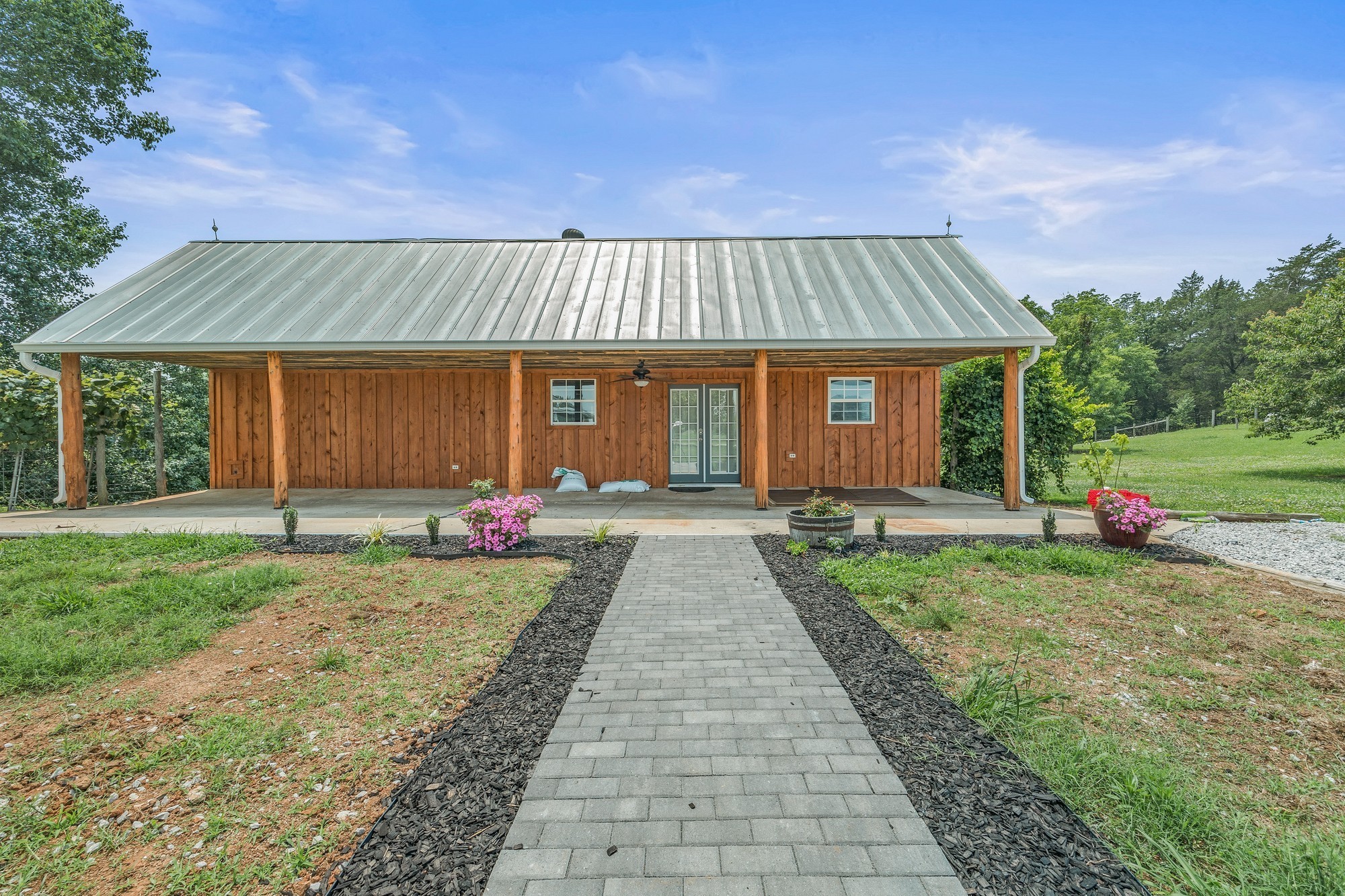 899 Messenger Road Sparta, TN 38583 - Photo 59 of 68 a front view of a house with a yard and garage