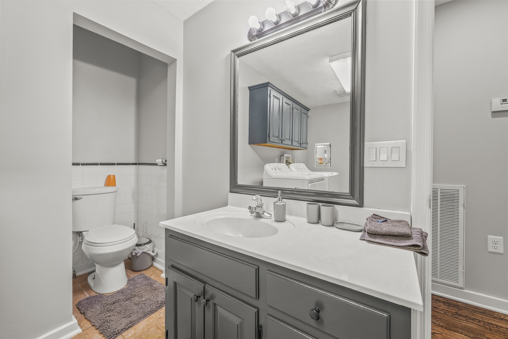 899 Messenger Road Sparta, TN 38583 - Photo 66 of 68 a bathroom with a sink vanity granite and toilet