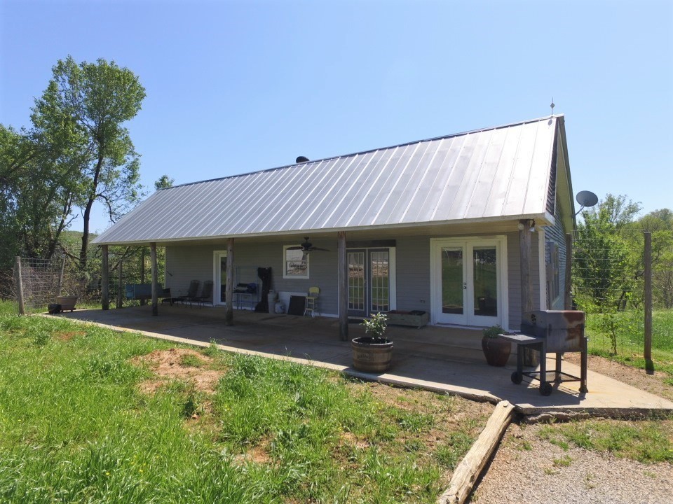 899 Messenger Road Sparta, TN 38583 - Photo 8 of 68 a view of a house with sitting area and garden