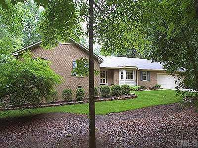 11919 Appaloosa Run East Raleigh, NC 27613 - Photo 1 of 1 a front view of a house with a garden
