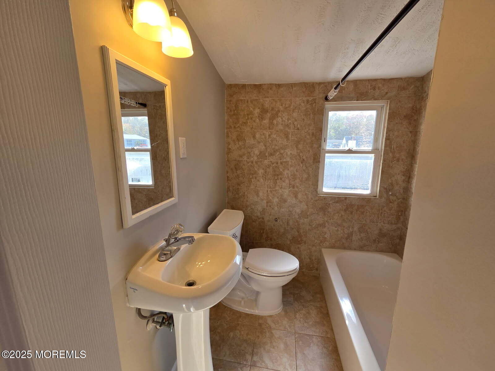 6 Trumen Place, Unit 1 Keansburg, NJ 07734 - Photo 16 of 19 a bathroom with a sink toilet and shower