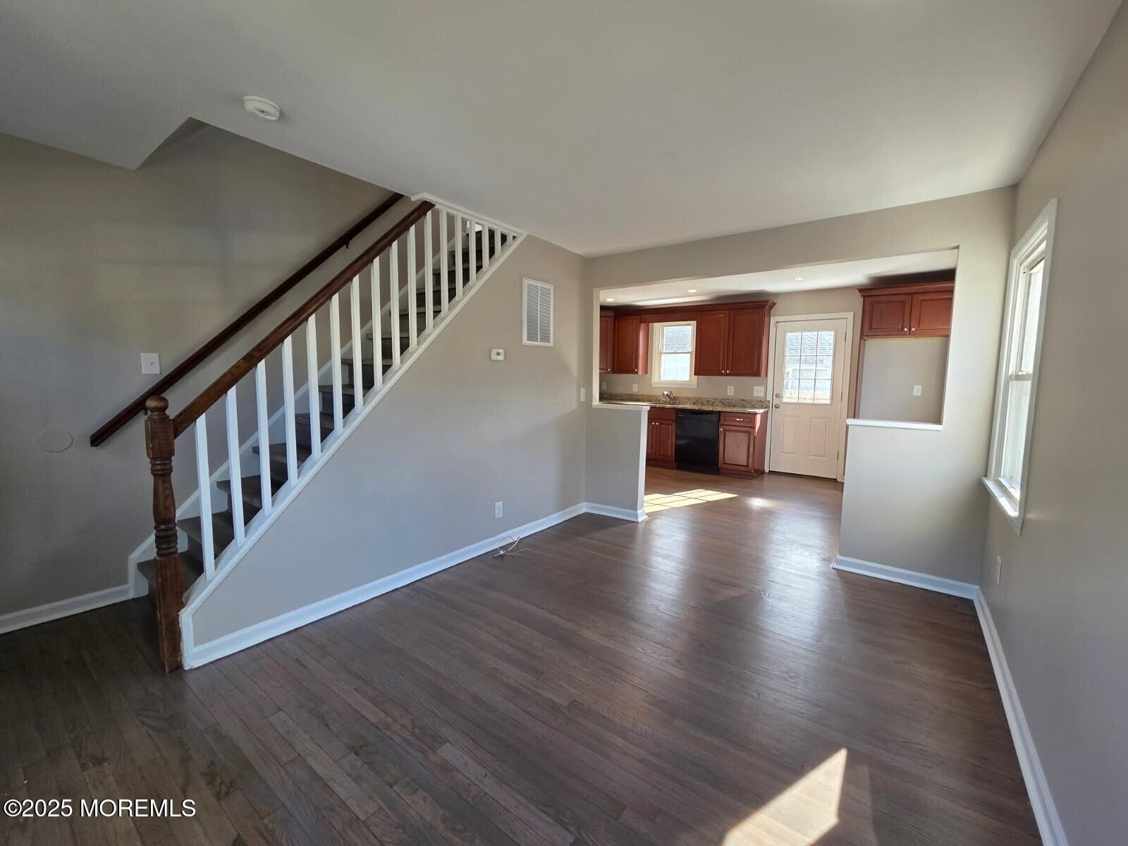 6 Trumen Place, Unit 1 Keansburg, NJ 07734 - Photo 7 of 19 a view of a living room with wooden floor windows and a fireplace