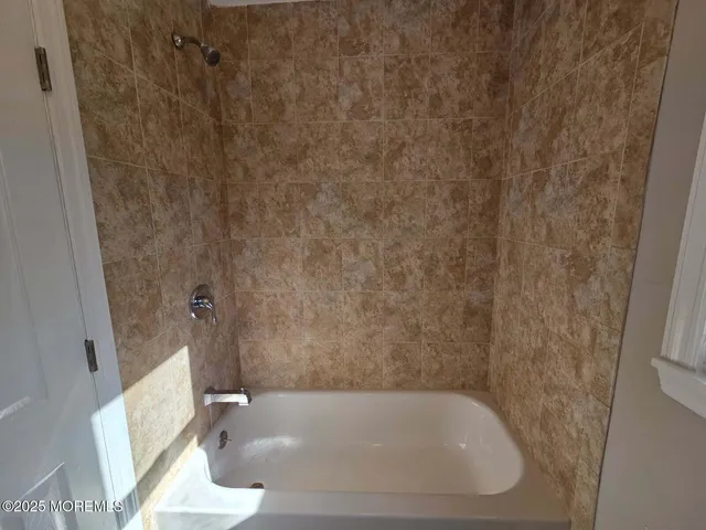 a close view of a bathtub in bathroom