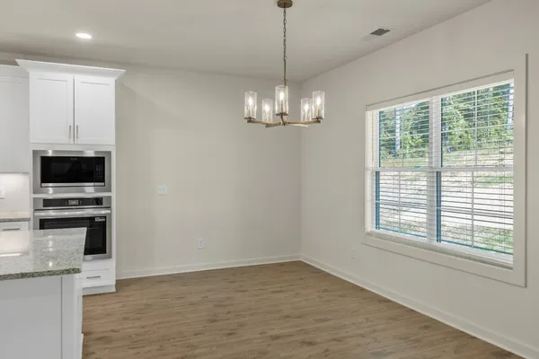 a view of a kitchen with microwave and stove