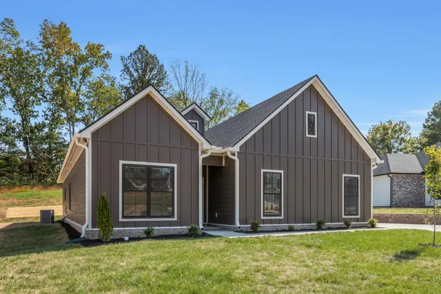 a front view of a house with a yard