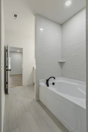 a bathroom with a glass shower door