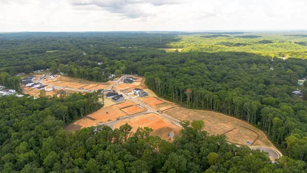 an aerial view of a house with mountain view