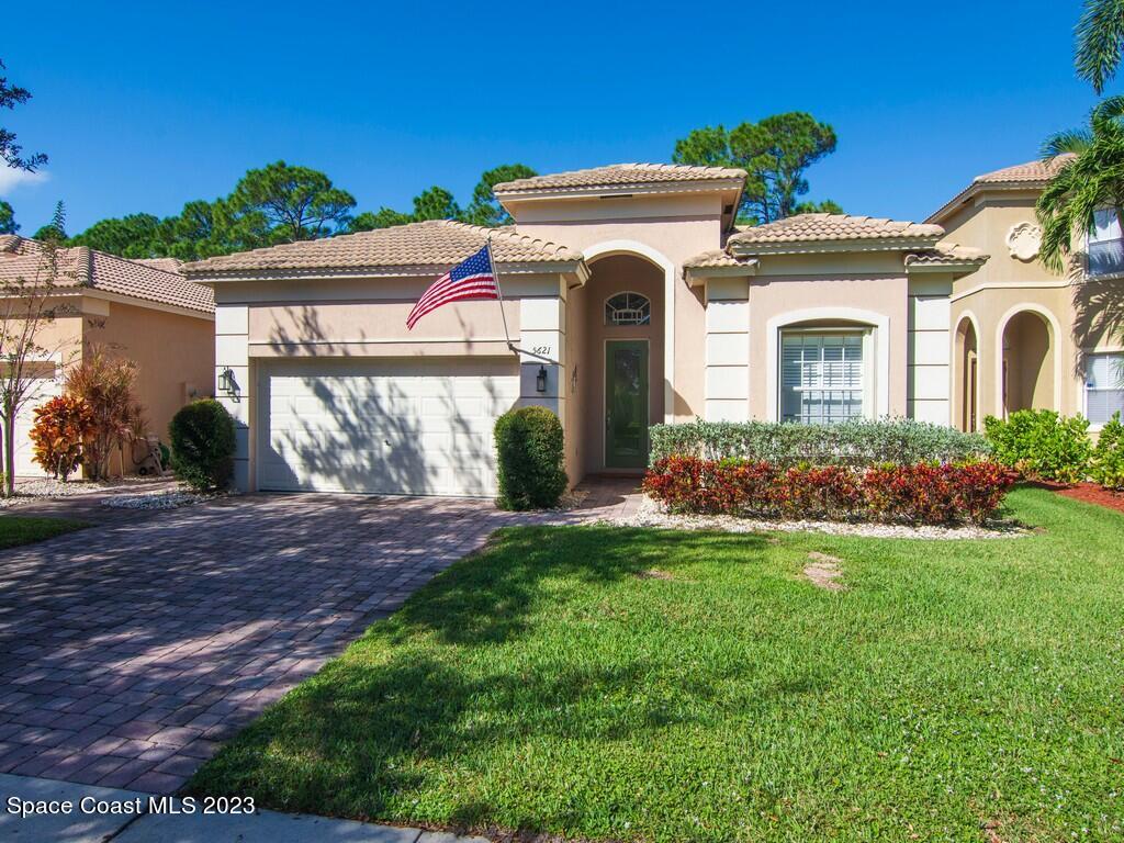 5621 Spanish River Road Fort Pierce, FL 34951 - Photo 1 of 34 a front view of a house with a garden