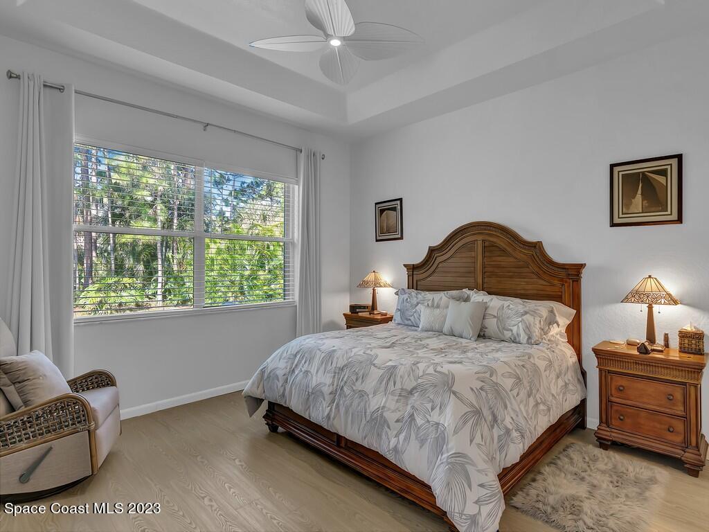 5621 Spanish River Road Fort Pierce, FL 34951 - Photo 12 of 34 a bedroom with a bed and a couch