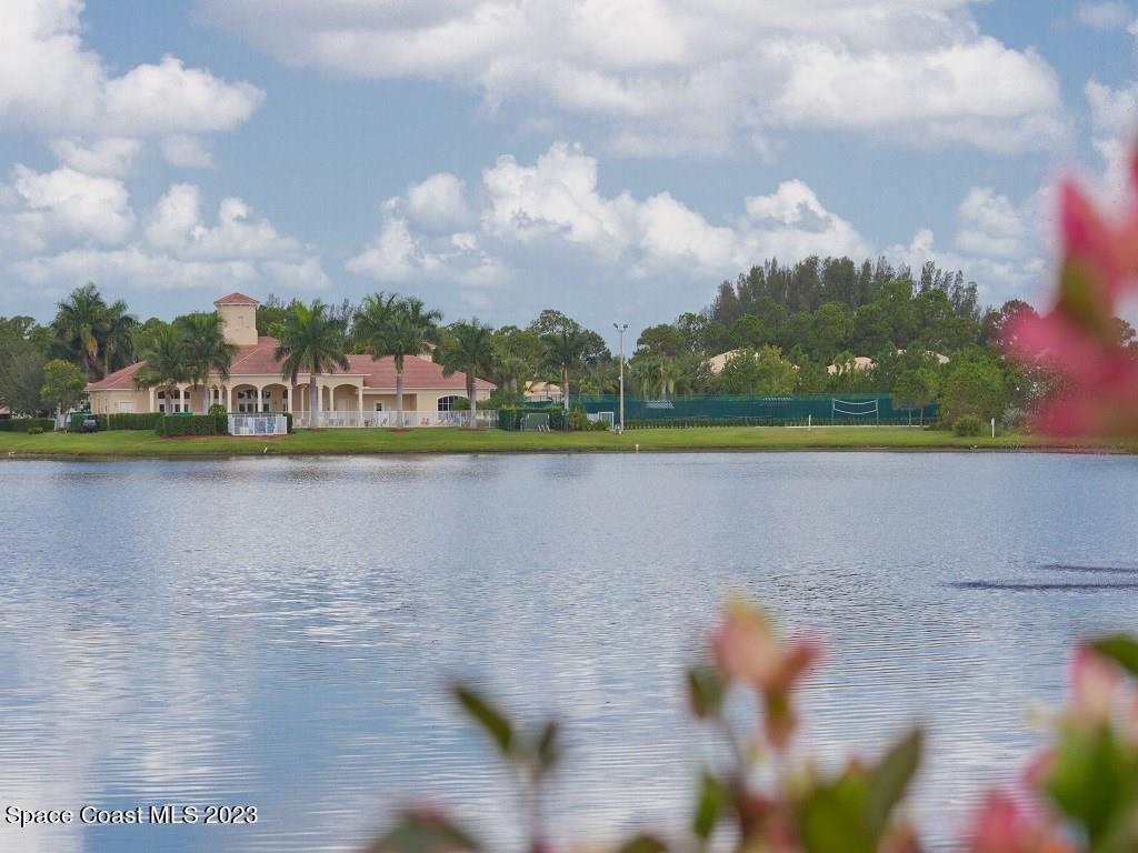5621 Spanish River Road Fort Pierce, FL 34951 - Photo 29 of 34 a view of a lake with houses in the background