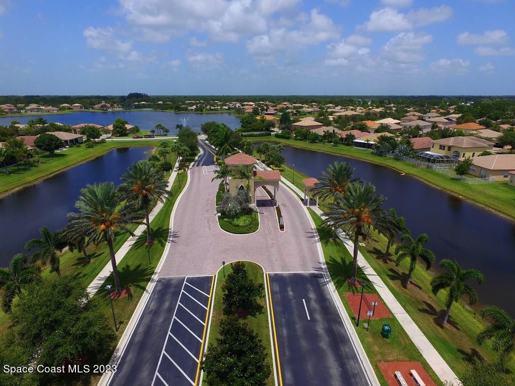 5621 Spanish River Road Fort Pierce, FL 34951 - Photo 31 of 34 an aerial view of residential houses with outdoor space and lake view