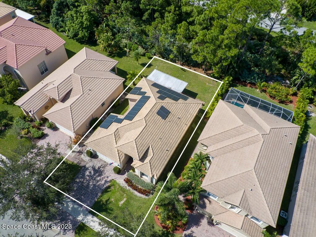 5621 Spanish River Road Fort Pierce, FL 34951 - Photo 32 of 34 an aerial view of a house with a yard