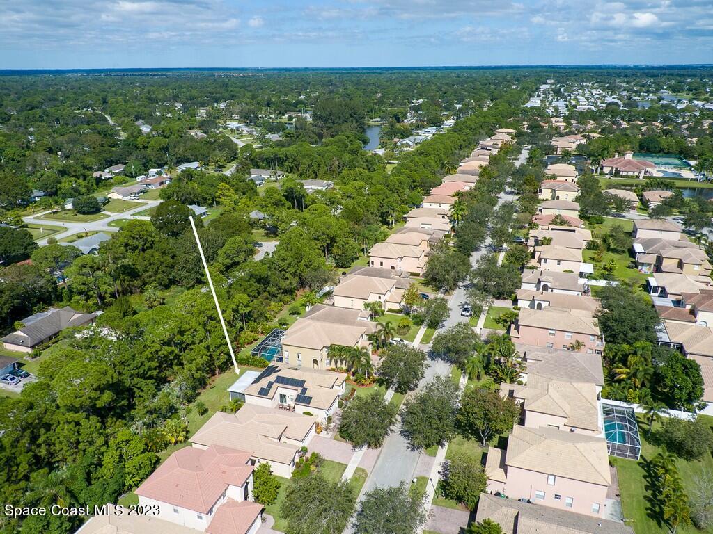 5621 Spanish River Road Fort Pierce, FL 34951 - Photo 33 of 34 an aerial view of residential houses with outdoor space