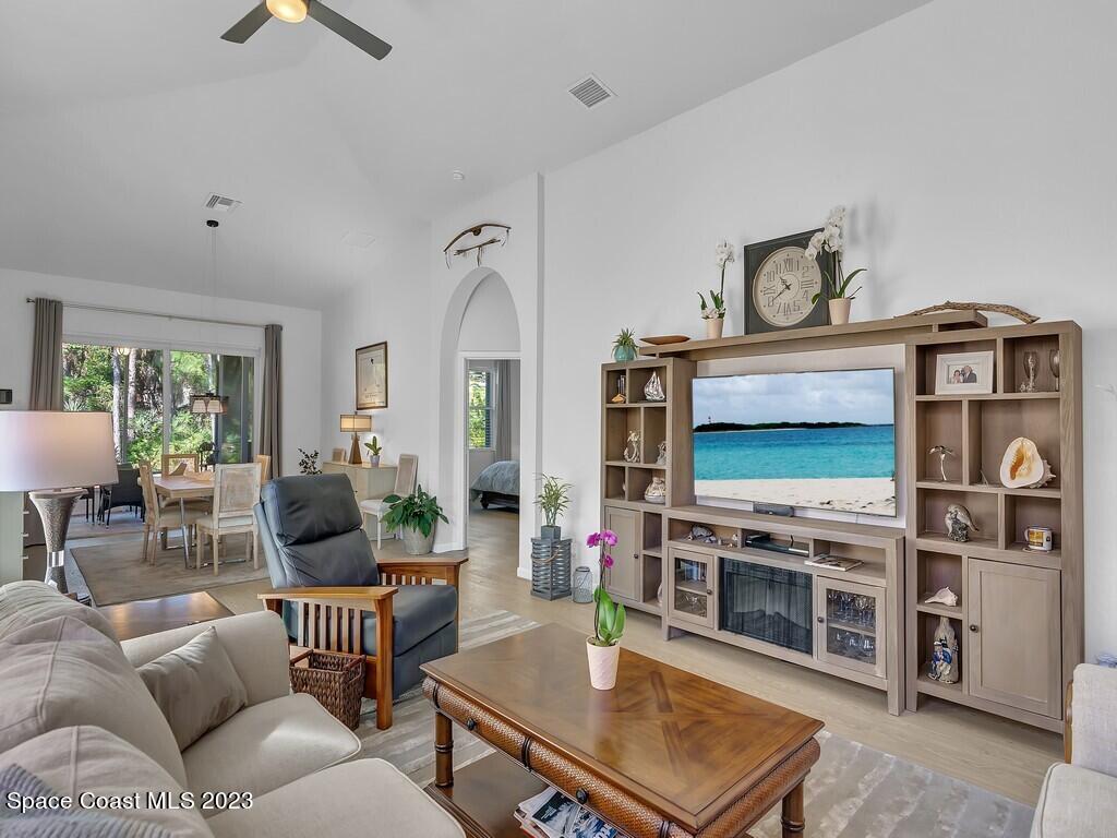 5621 Spanish River Road Fort Pierce, FL 34951 - Photo 4 of 34 a living room with furniture and a flat screen tv