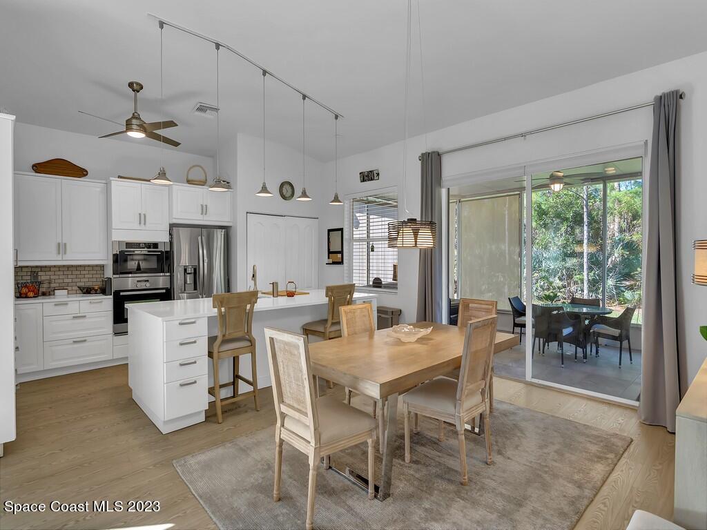 5621 Spanish River Road Fort Pierce, FL 34951 - Photo 7 of 34 a view of kitchen with cabinets and wooden floor