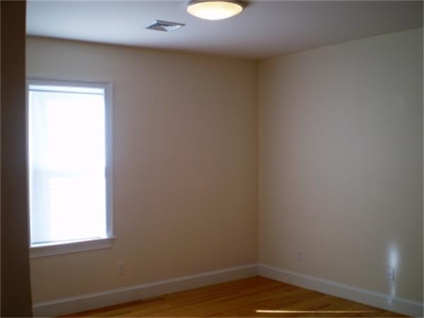 111 Heath Street Boston, MA 02120 - Photo 14 of 17 a view of a small space with wooden floor and a window
