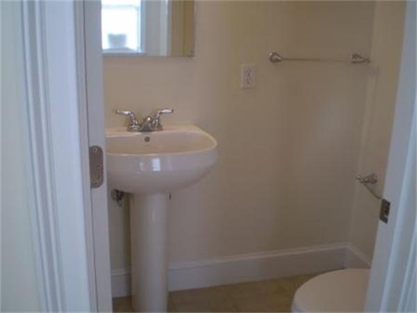 111 Heath Street Boston, MA 02120 - Photo 9 of 17 a bathroom with a sink toilet and shower
