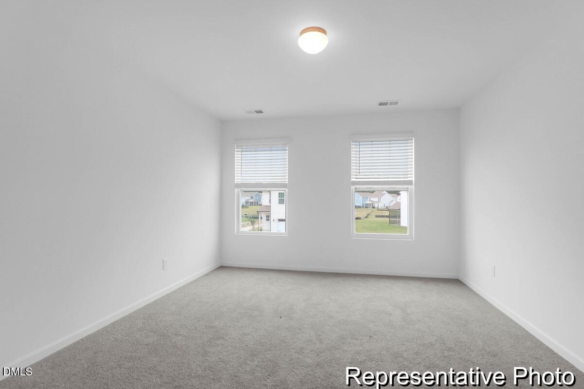 40 Birchstone Trail, Unit 225P Erwin, NC 28339 - Photo 18 of 26 an empty room with windows