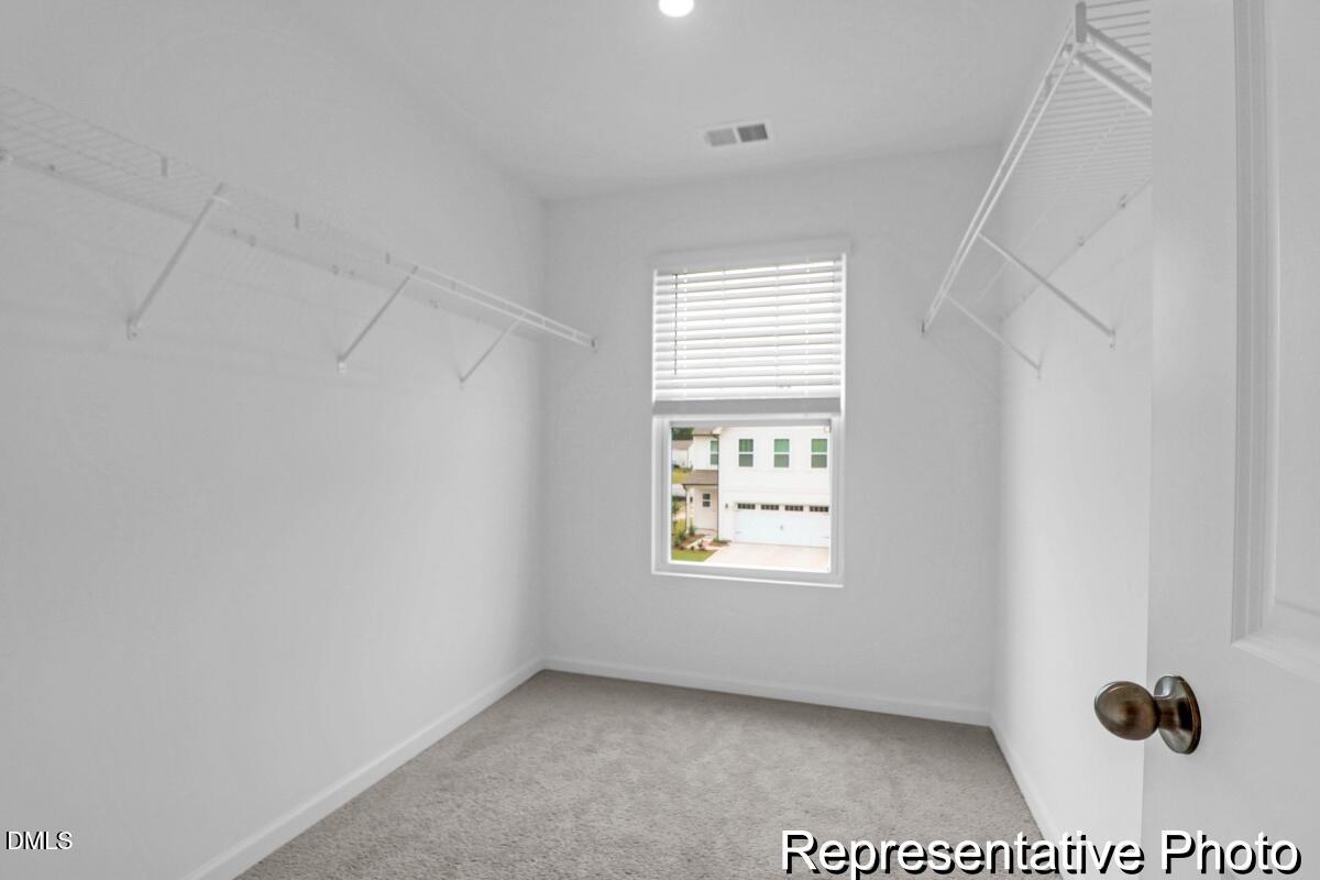 40 Birchstone Trail, Unit 225P Erwin, NC 28339 - Photo 20 of 26 an empty room with windows and exposed radiator