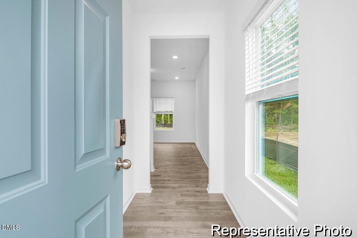40 Birchstone Trail, Unit 225P Erwin, NC 28339 - Photo 2 of 26 a view of hallway with wooden floor and a rug